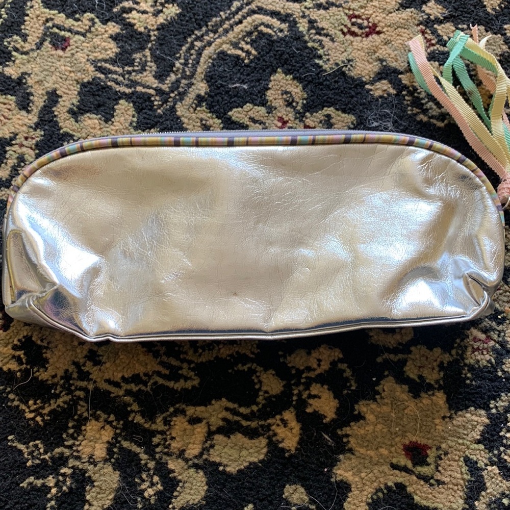 Lightly used cosmetic brush bag.